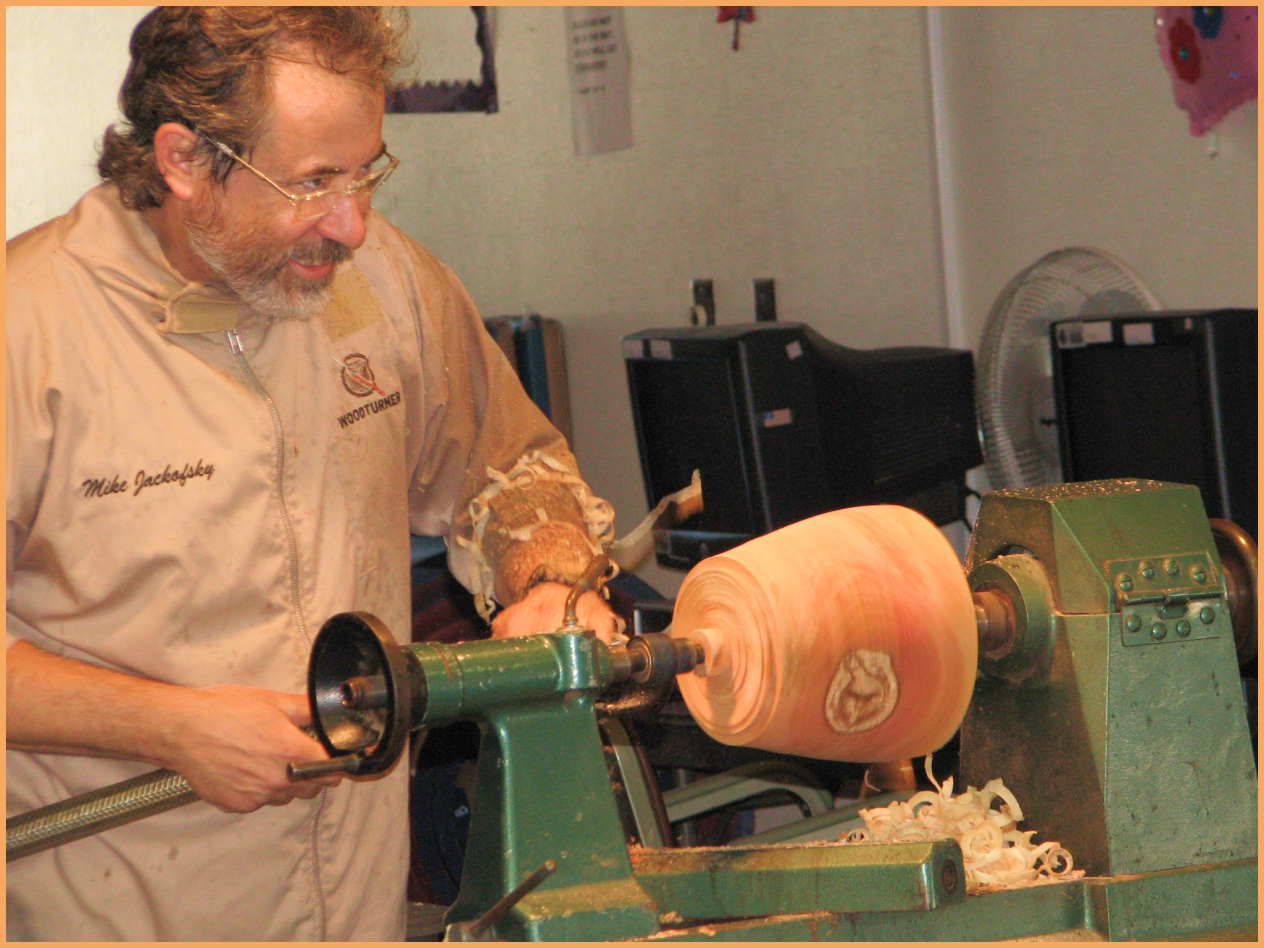 woman demonstrating wood carving